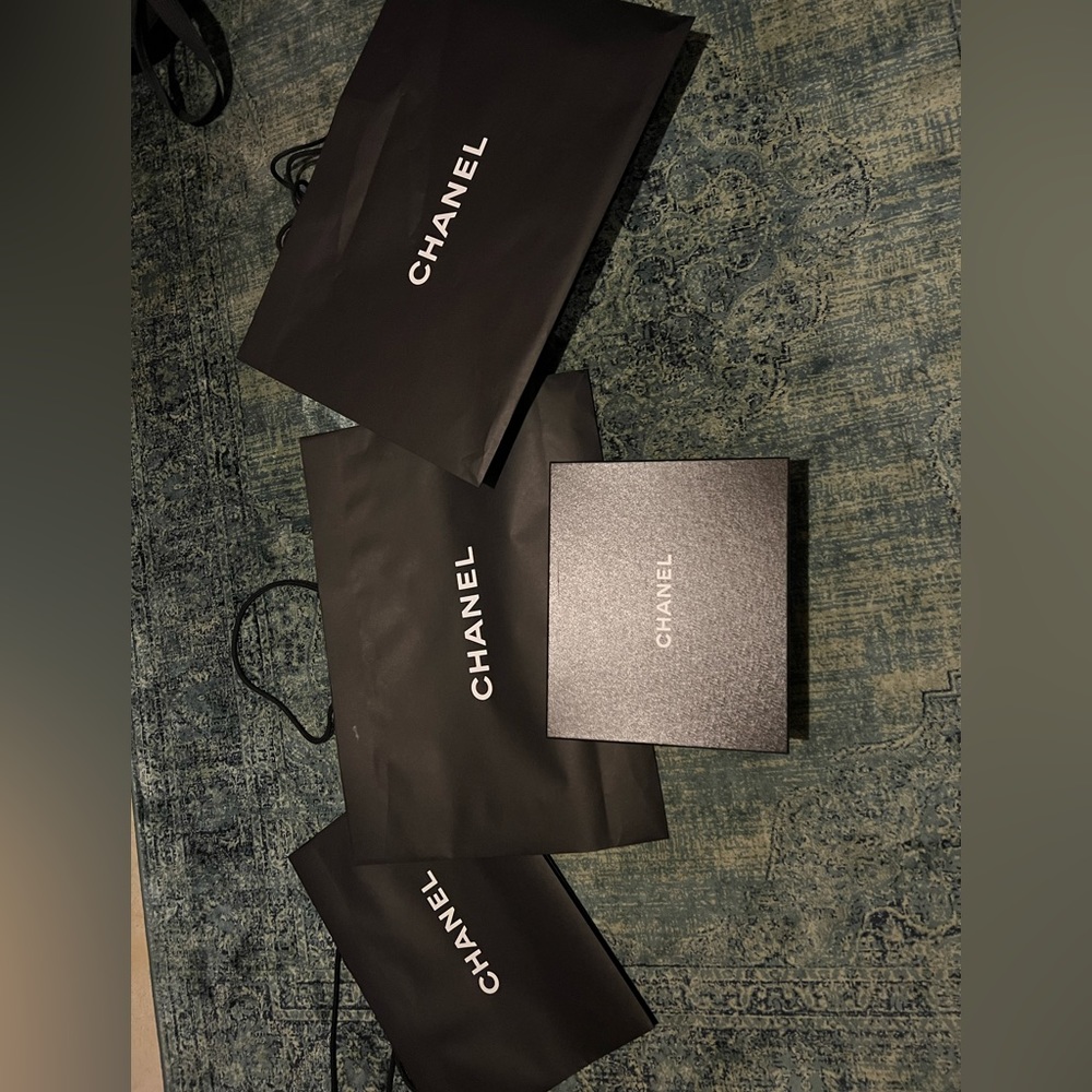 Two large and one medium Chanel bag and a medium box with banding’s.